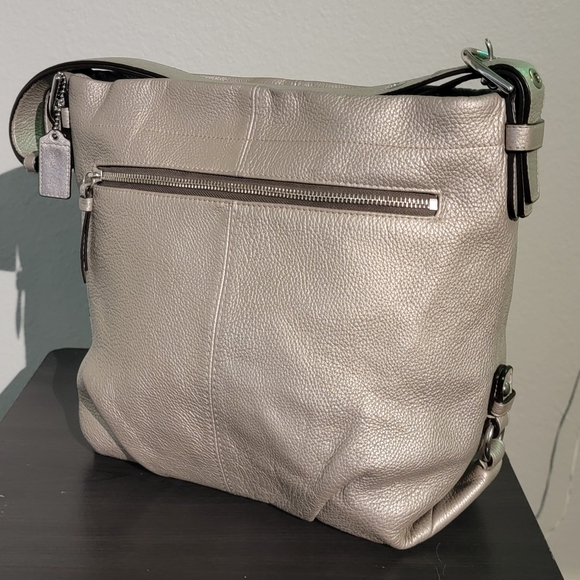 Coach Handbags - Coach Metallic Silver Leather Duffle Shoulder Bag